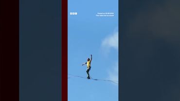 Competitors walk slackline 400m above a Chinese gorge. #BBCNews
