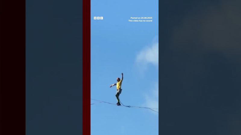 Competitors walk slackline 400m above a Chinese gorge. #BBCNews
