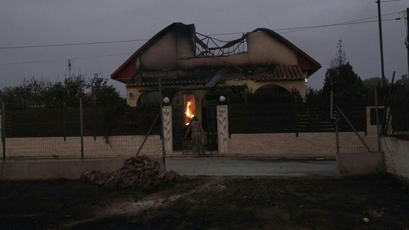 Wildfires tear through homes in Greece as high winds stoke blazes | AFP
