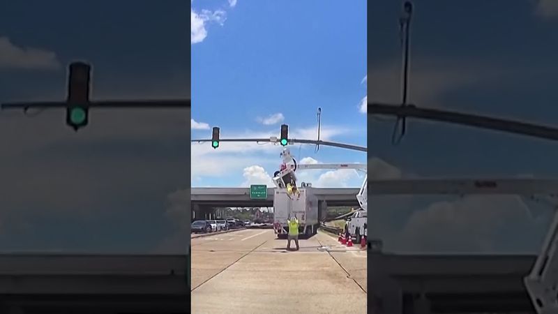 Truck hits tradie working on traffic lights