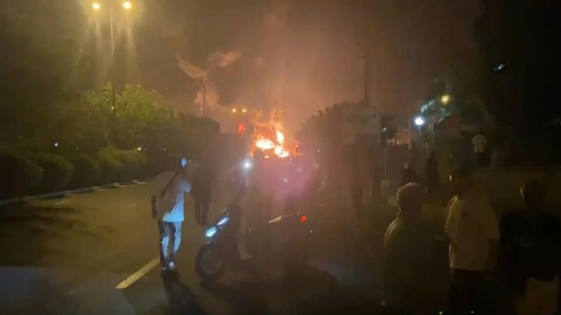 Flames blaze from Tehran oil depots hit by Israeli strike | AFP