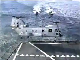 Helicopter crashes into aircraft carrier then sinks