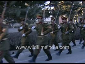 Armed (Russian?) troops march goose-step in military boots at Presidential Palace in Afghanistan