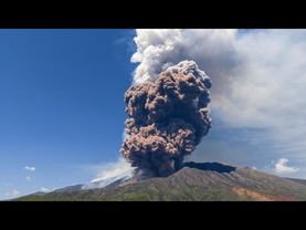 Massive plume of ash and volcanic material billows above Mount Etna as it erupts again