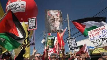 Sao Paulo protesters burn poster of Trump depicted as a devil | AFP
