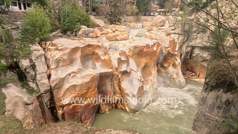 Water carved beautiful rock formations at Gaurikund waterfalls below Gangotri Temple in the Himalaya