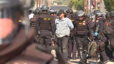 Police officers arrest protesters marching against immigration raids in Los Angeles | AFP