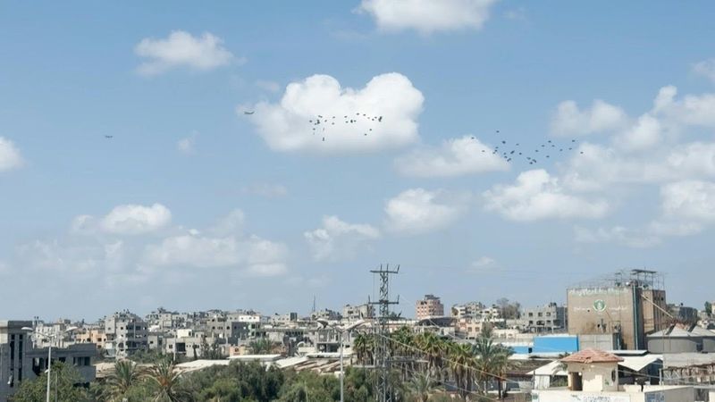 Plane drops aid over al-Bureij refugee camp in the central Gaza Strip | AFP