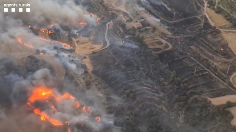 Wildfire killing two rages in Spain | AFP