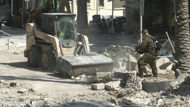 Israeli first responders clear rubble in Haifa after Iran missile attack | AFP