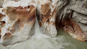 Gauri Kund waterfalls in Gangotri Uttarakhand takes the Ganga down a beautufil rocky chute of browns