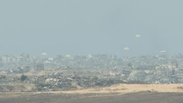 Parachutes fall during airdrop over northern Gaza | AFP