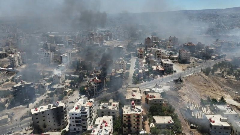 AERIAL SHOTS: Smoke rises over Syria's Sweida as tribal fighters deploy | AFP