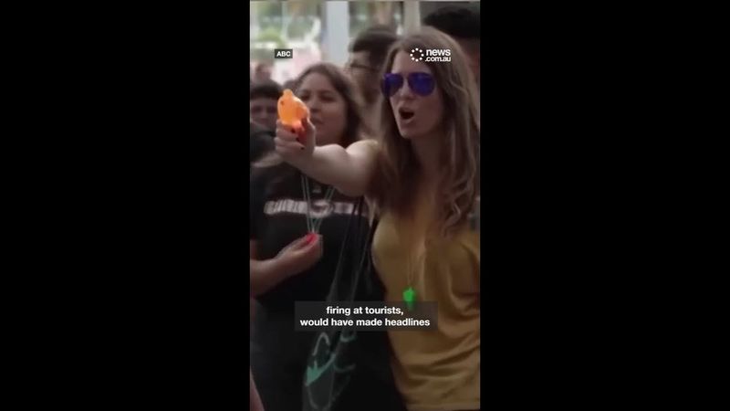 Furious Spanish protesters spray tourists with water pistols