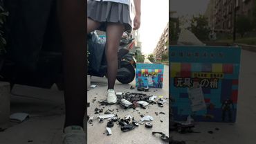 My sister crushed five remote-controlled cars outdoors.