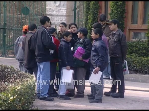 Kashmiri children being taught painting in the 1990's near the Dal Lake in Srinagar, Jammu & Kashmir