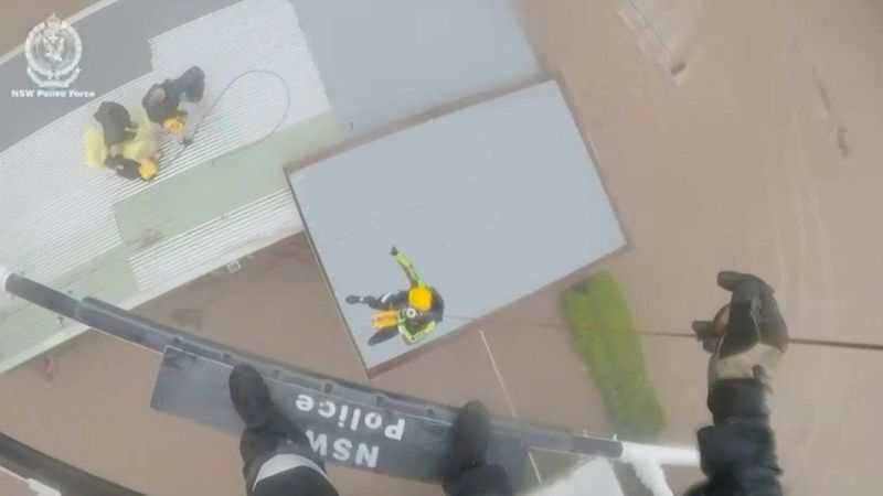 Australians rescued off rooftops amid deadly floods | AFP