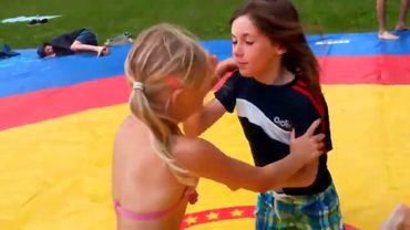 Mixed wrestling girl vs girl match on the mat