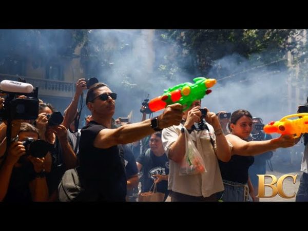 Protesters in Spain shoot water guns at tourists