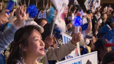 Supporters cheer as South Korea's Lee appears on stage in Seoul | AFP
