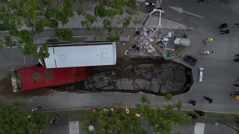 Mexico: massive sinkhole swallows two trucks in Guadalajara, no injuries reported | AFP