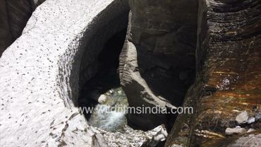 Snow bridge in Sunderdhunga valley covered in monsoon snow, towards Maiktoli peak in Uttarakhand