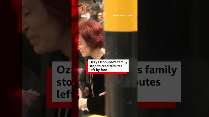 Ozzy Osbourne's family stop to read tributes in Birmingham. #OzzyOsbourne #BBCNews