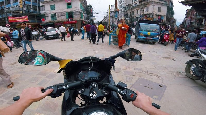 On a motorcycle around Nepal. Traffic in Kathmandu.