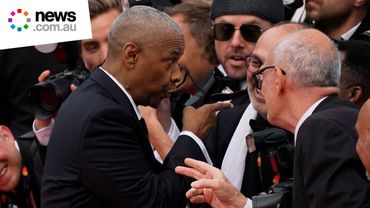 Denzel Washington snaps at photographer on red carpet
