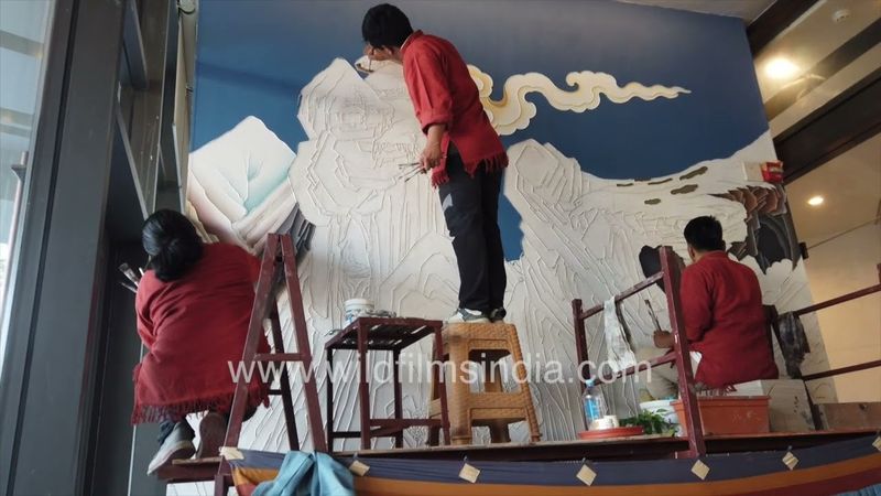 Tibetan-Nepali Wall art in Kathmandu, being painted at the Hilton Kathmandu, Nepal
