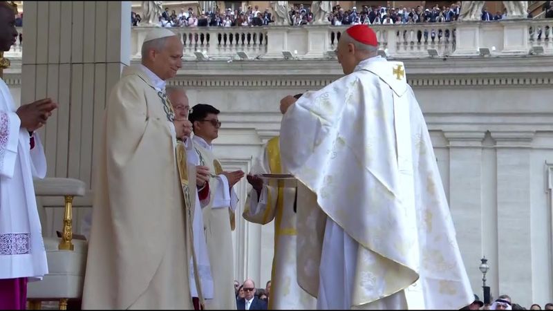Pope Leo XIV receives pontifical emblems of the pallium and the fisherman's ring | AFP