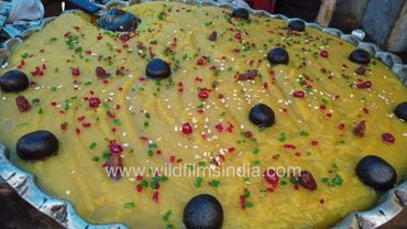 People are eating sweets and biryani during the Bakrid festival at the Jama Masjid in Delhi
