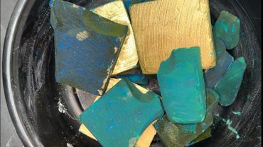 Bucket of dyed green chalk