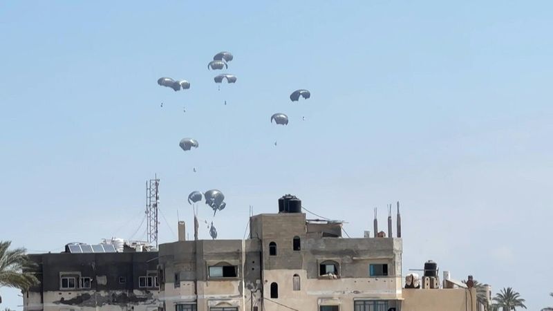 Plane drops aid packages over central Gaza camps | AFP