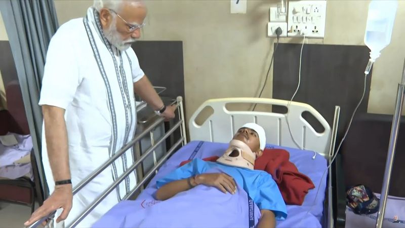 India PM Modi visits survivors of Air India crash | AFP