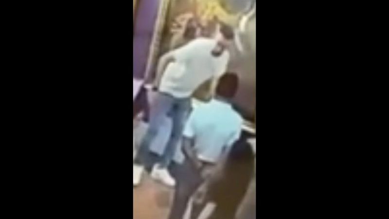 Tourist rips through priceless painting while posing for photo