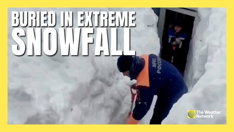 Snowbanks Tower Over Doorways After Record Snowfall in East Russia