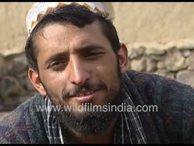 Taliban man smiles while in metal chains on legs, in 1997: Taliban will return and attack America