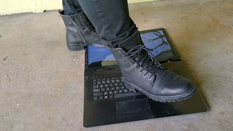 Big girl trample laptop in Boots