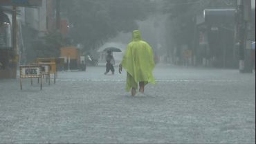 Philippines flooding displaces thousands, two missing | AFP