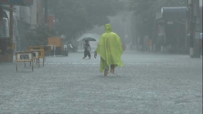 Philippines flooding displaces thousands, two missing | AFP