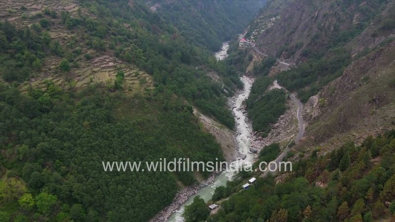 Ganga river snakes through gorge between Uttarkashi and Harsil, in narrow valley with steep forests