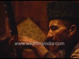 Sufi music being performed for family guests at old walnut wood lined house in Srinagar Kashmir