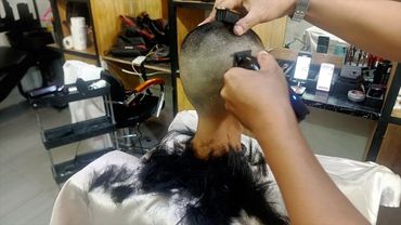 Beautiful model shaved off all her hair at barbershop