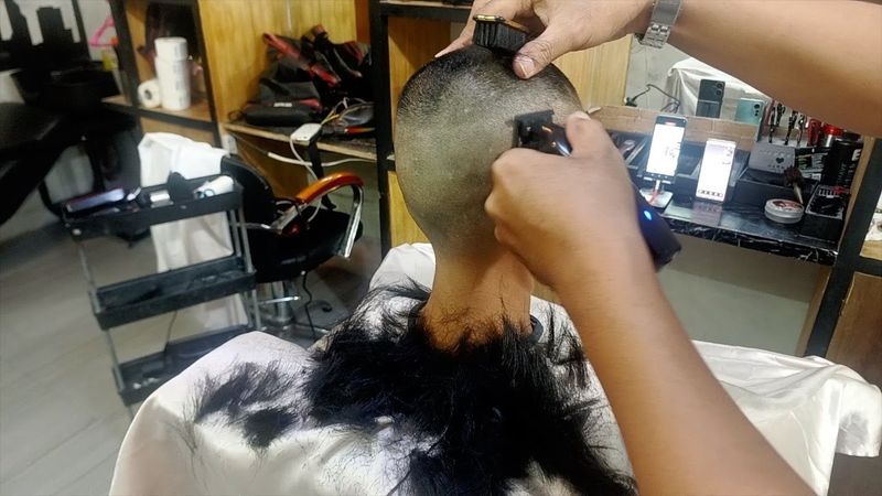 Beautiful model shaved off all her hair at barbershop