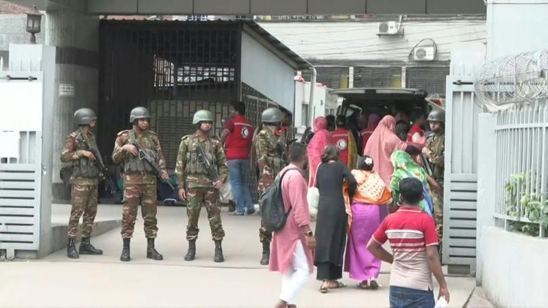 Soldiers stand guard outside Bangladesh hospital treating fighter jet crash victims | AFP