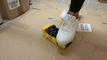 Girl Crushing a toy Garage Truck with White Sneaker 