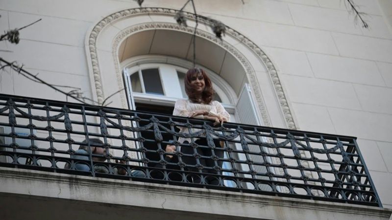 Argentine ex-president Kirchner greets supporters from balcony after Supreme Court decision | AFP