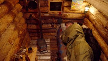 Man and Dog Stay Overnight in a Forest Cabin — Then a Snowstorm Begins