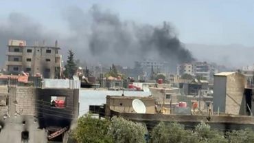 Smoke billows as Syria tribal fighters deploy in Druze village near Sweida | AFP